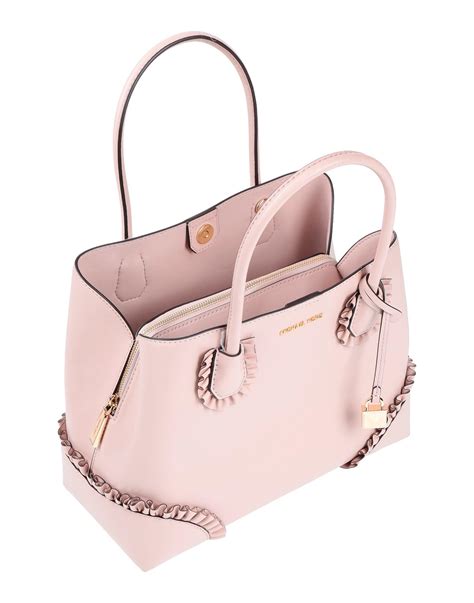 michael kors light pink handbag|michael kors pink suitcase.